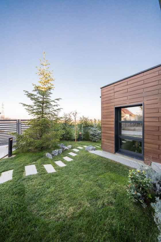 ABET LAMINATI Placare fatada casa HPL compact imitatie lemn MEG - Panouri din HPL compact pentru