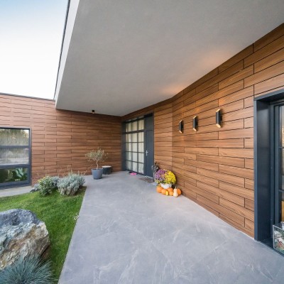 ABET LAMINATI Placare fatada casa HPL compact imitatie lemn MEG - Panouri din HPL compact pentru