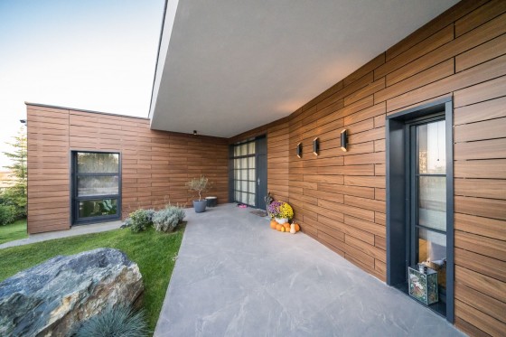 ABET LAMINATI Placare fatada casa HPL compact imitatie lemn MEG - Panouri din HPL compact pentru