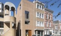 O casă îngustă construită din 15 tone de deșeuri industriale Locuinta ingusta din Rotterdam reuseste sa
