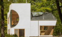 Arhitectul Steven Holl sculpteaza decupaje geometrice pentru casa unor artisti Aceasta casa este o sculptura arhitecturala