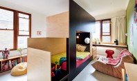 Un pat făcut pe comandă separă dormitorul comun si oferă spații pentru fiecare copil