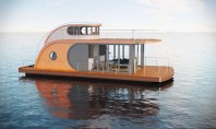 Trendul merge mai departe - case micro plutitoare Nautilus Hausboote este o casa plutitoare cu un