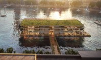 O clădire de birouri plutitoare complet off-grid este construită pe un râu din Europa Floating Office